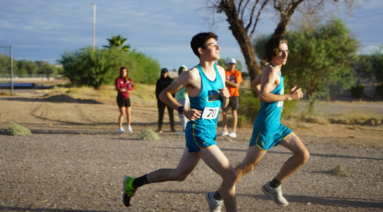 Two male runners racing eachother.