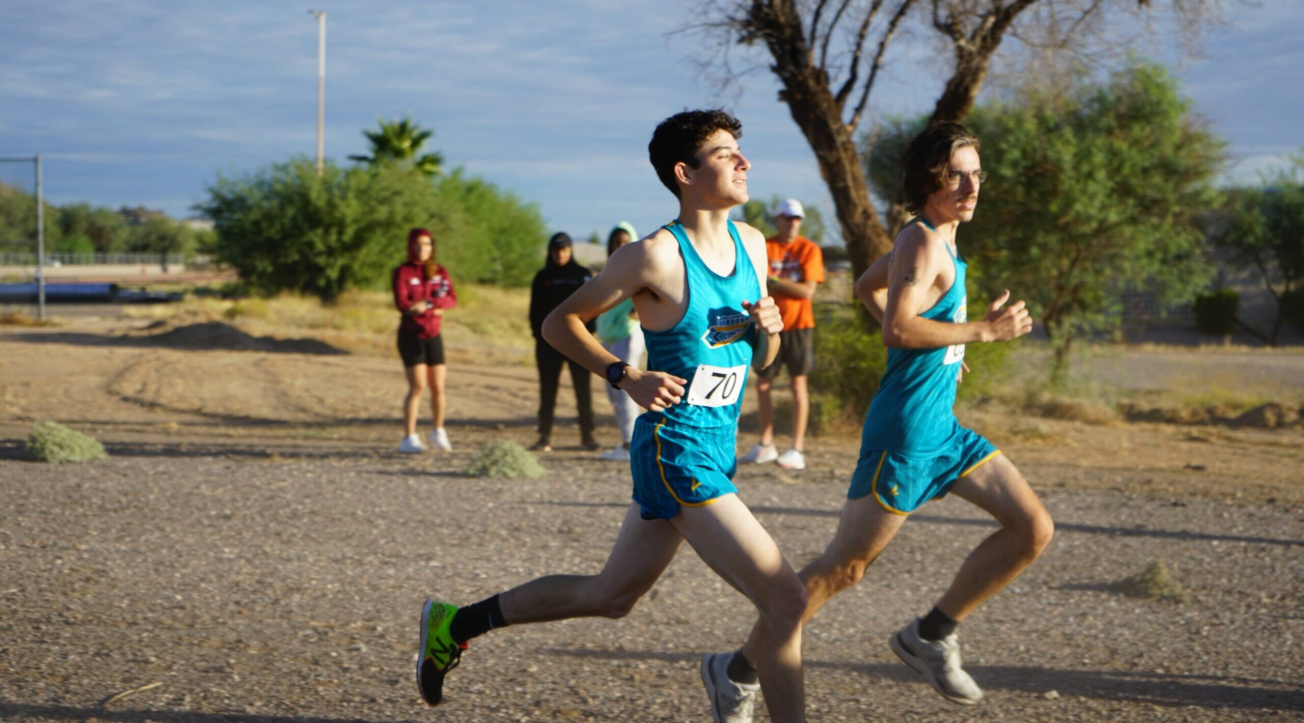 Two male runners racing eachother.