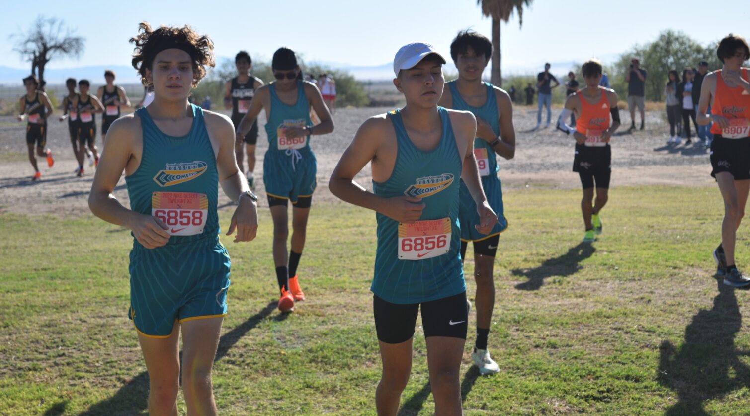 Four CCC male runners come to a running stop.