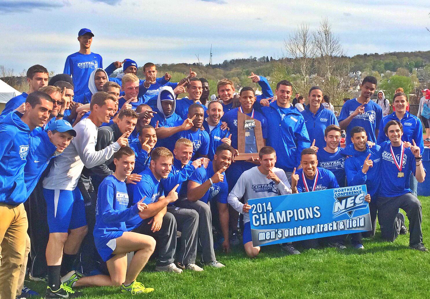 Track and field team posing with a championship sign.