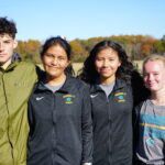 Four CCC athletes posing after their race.