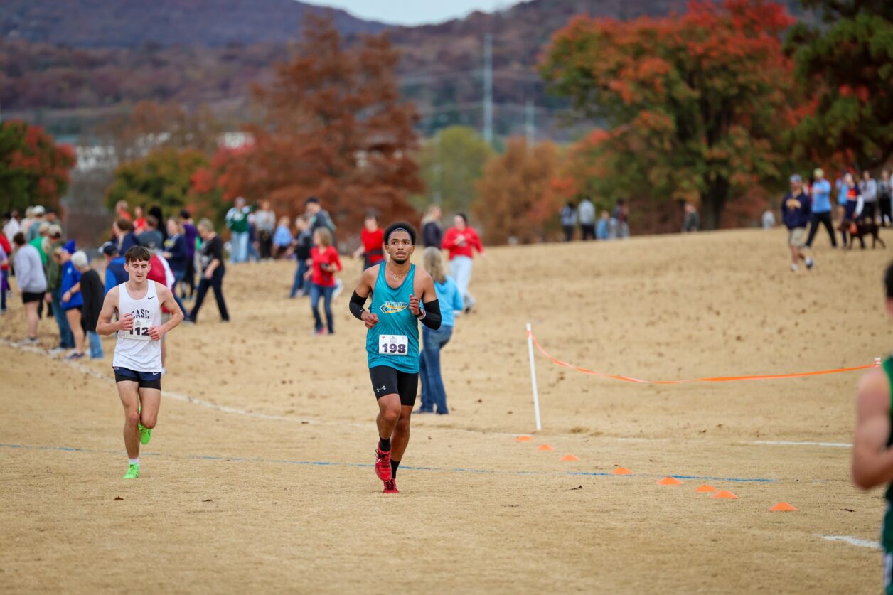 CCC athlete Hayden Williams running during a cross country race.