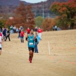 CCC athlete Hayden Williams running during a cross country race.