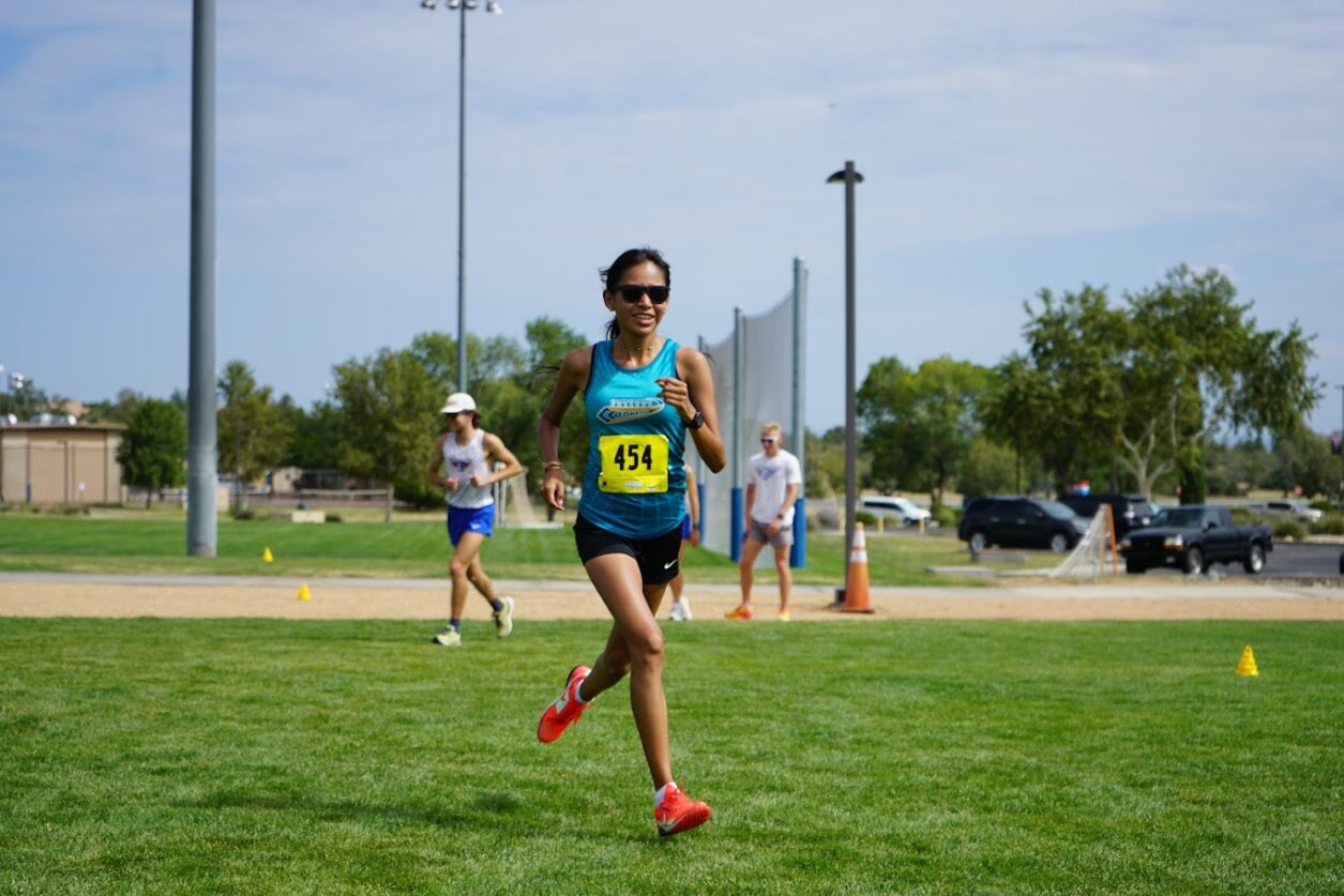 Cian Davis of Coconino Community College runs towards the finish line during a cross country race.