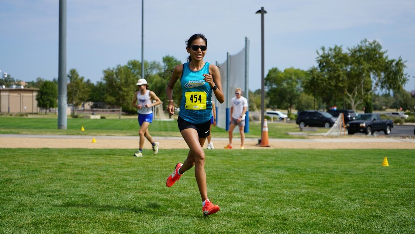 Cian Davis of Coconino Community College runs towards the finish line during a cross country race.