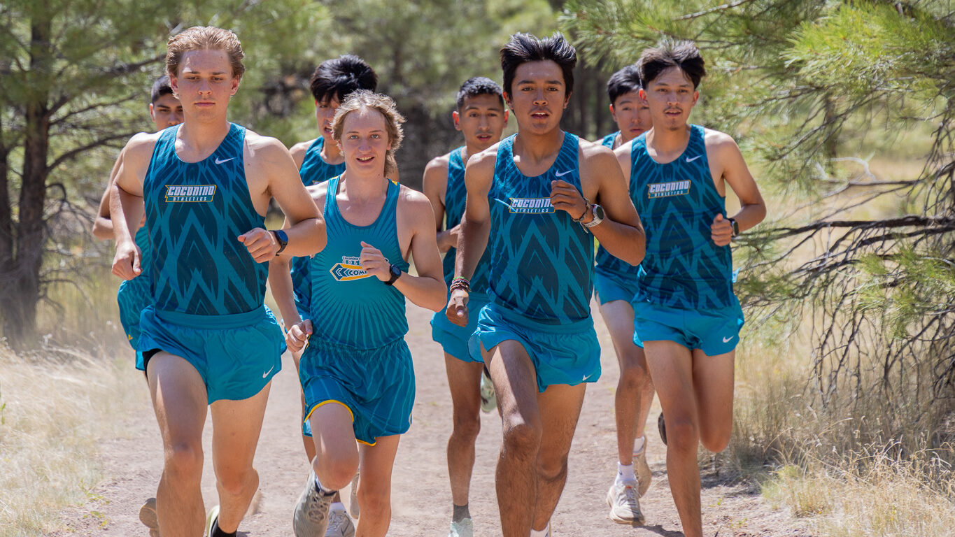 Men's cross country running as a pack.