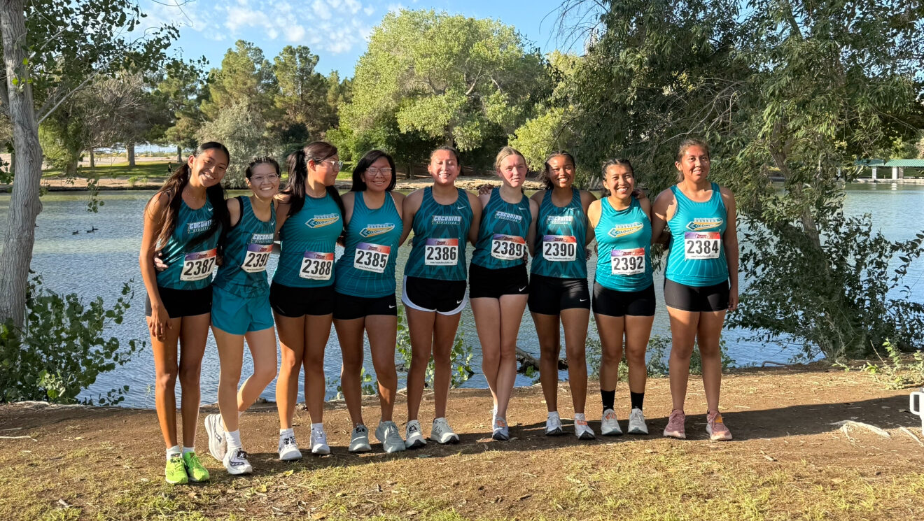 CCC's women's cross country team posing for a team photo post race.